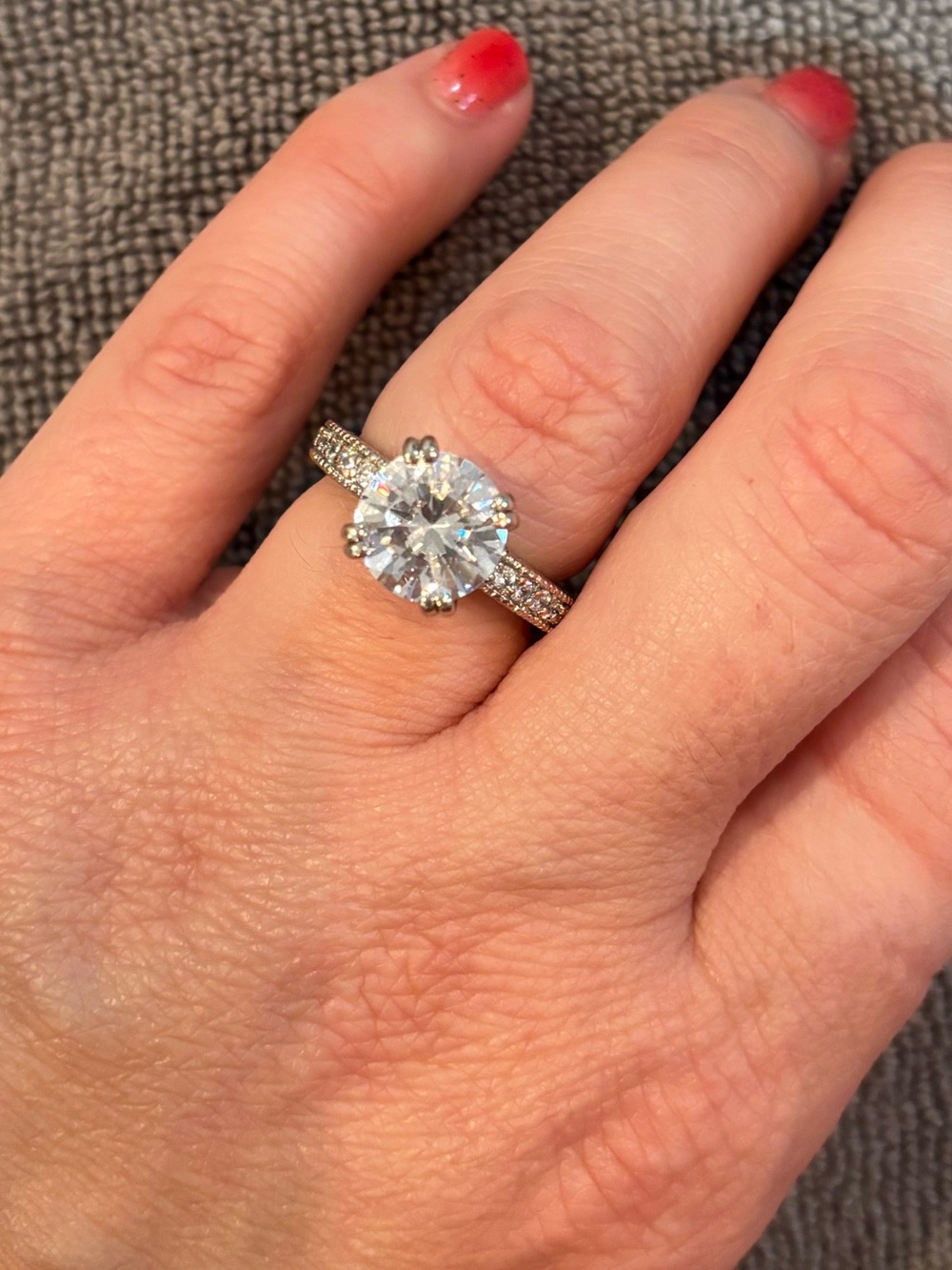 Sparkling Round-Cut Silver Engagement Ring with Clear Center Stone